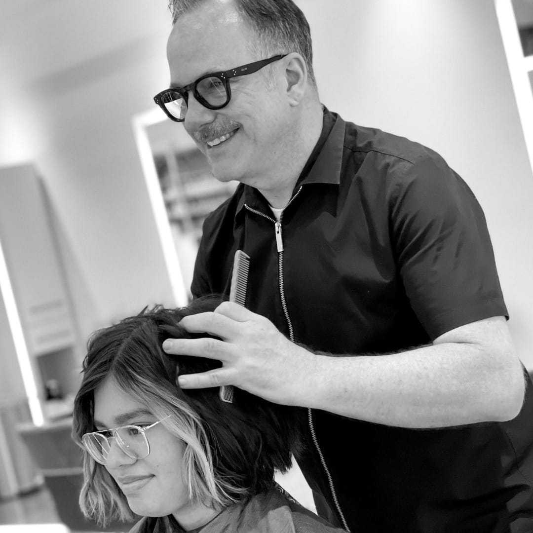 Portrait of Alan, a professional stylist at Hue Salon Houston, showcasing their expertise and style.