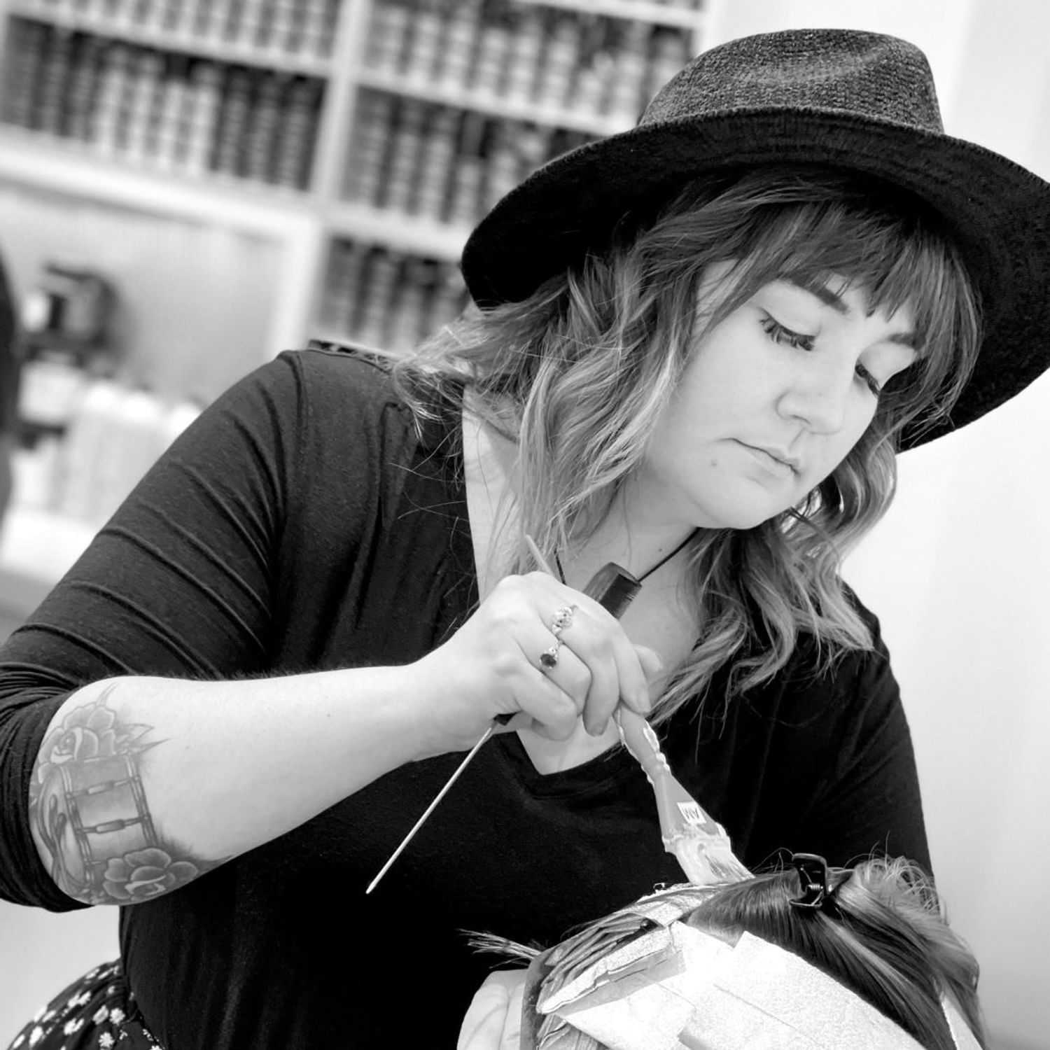 Portrait of Elise, a professional stylist at Hue Salon Houston, showcasing their expertise and style.