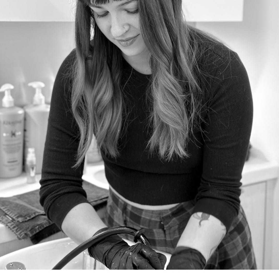 Portrait of Claire, a professional stylist at Hue Salon Houston, showcasing their expertise and style.