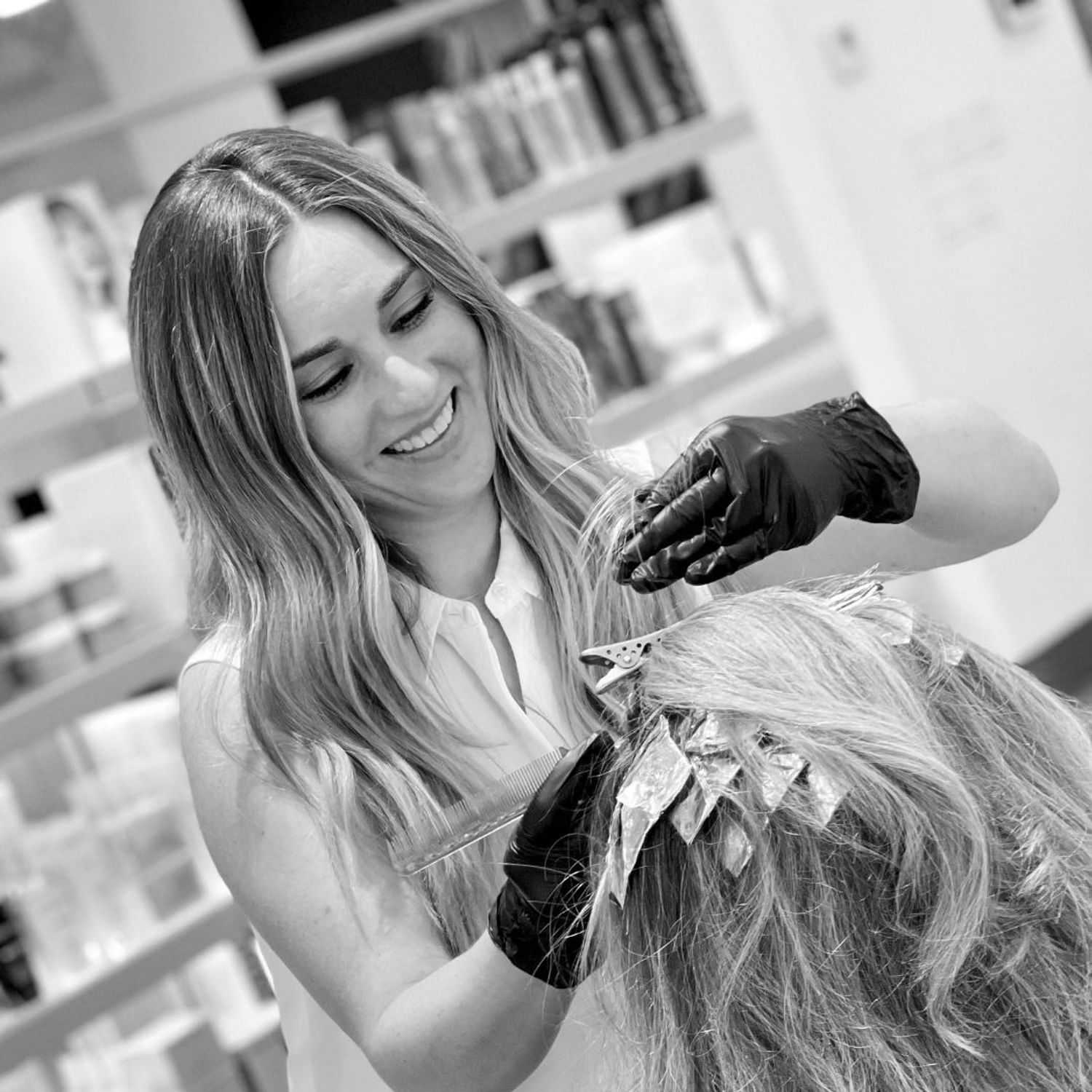 Portrait of Ashley, a professional stylist at Hue Salon Houston, showcasing their expertise and style.