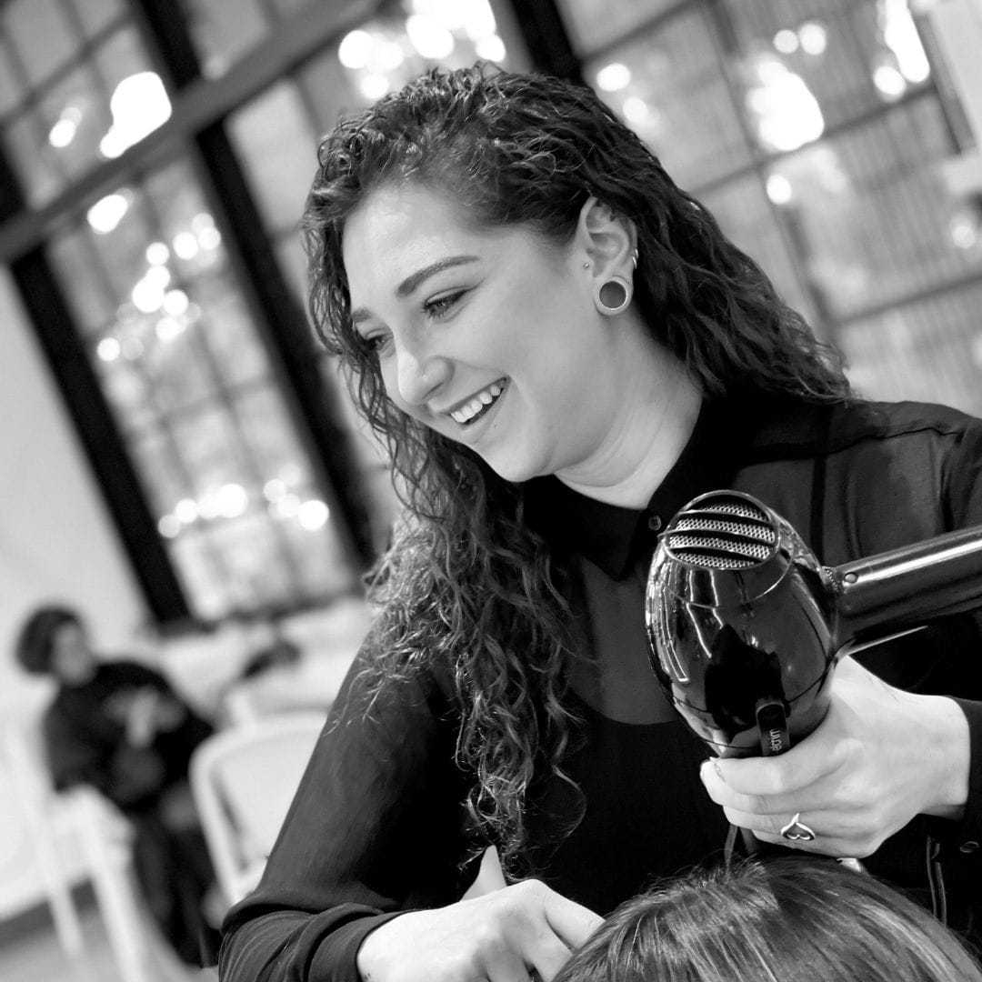 Portrait of Allegra, a professional stylist at Hue Salon Houston, showcasing their expertise and style.