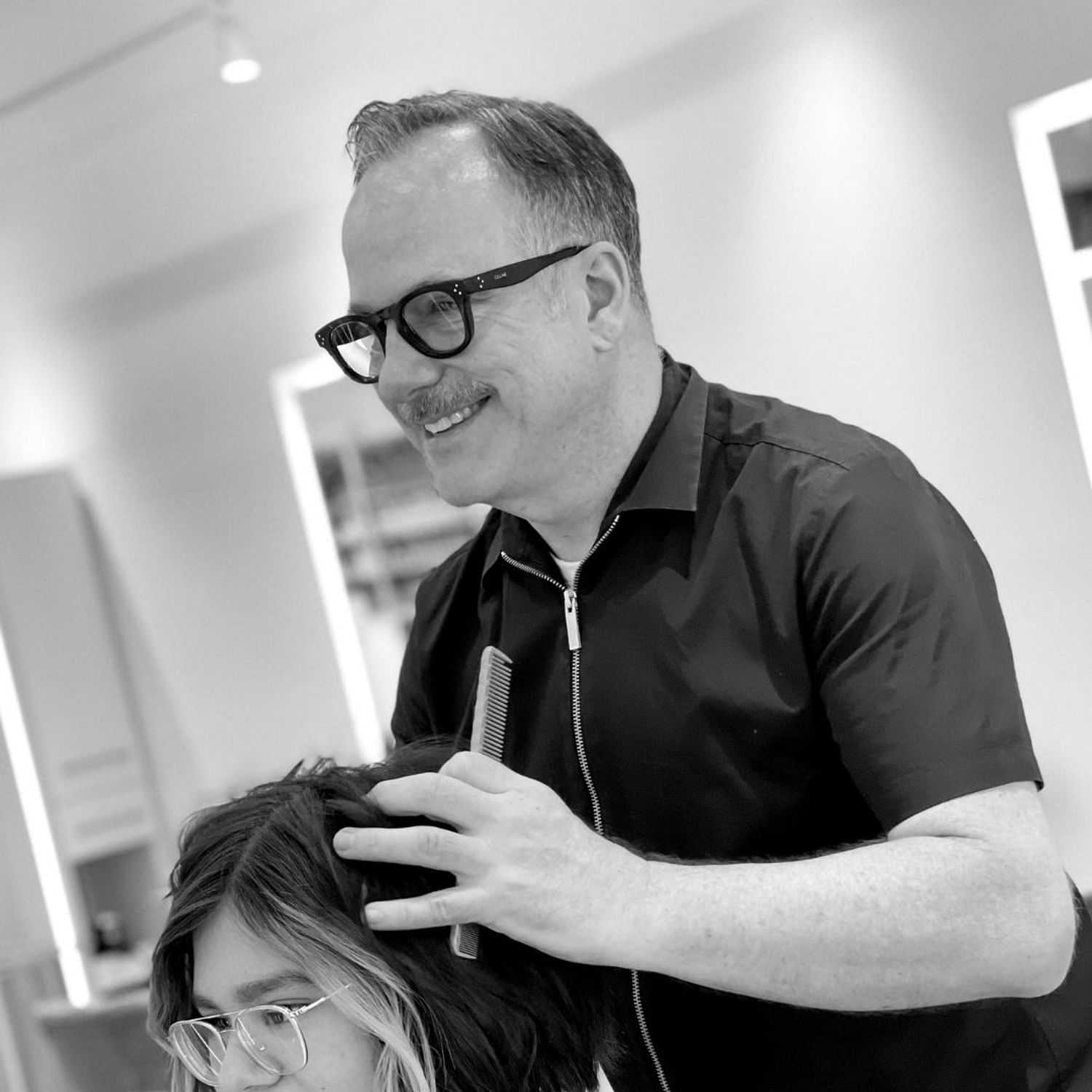 Portrait of Alan, a professional stylist at Hue Salon Houston, showcasing their expertise and style.