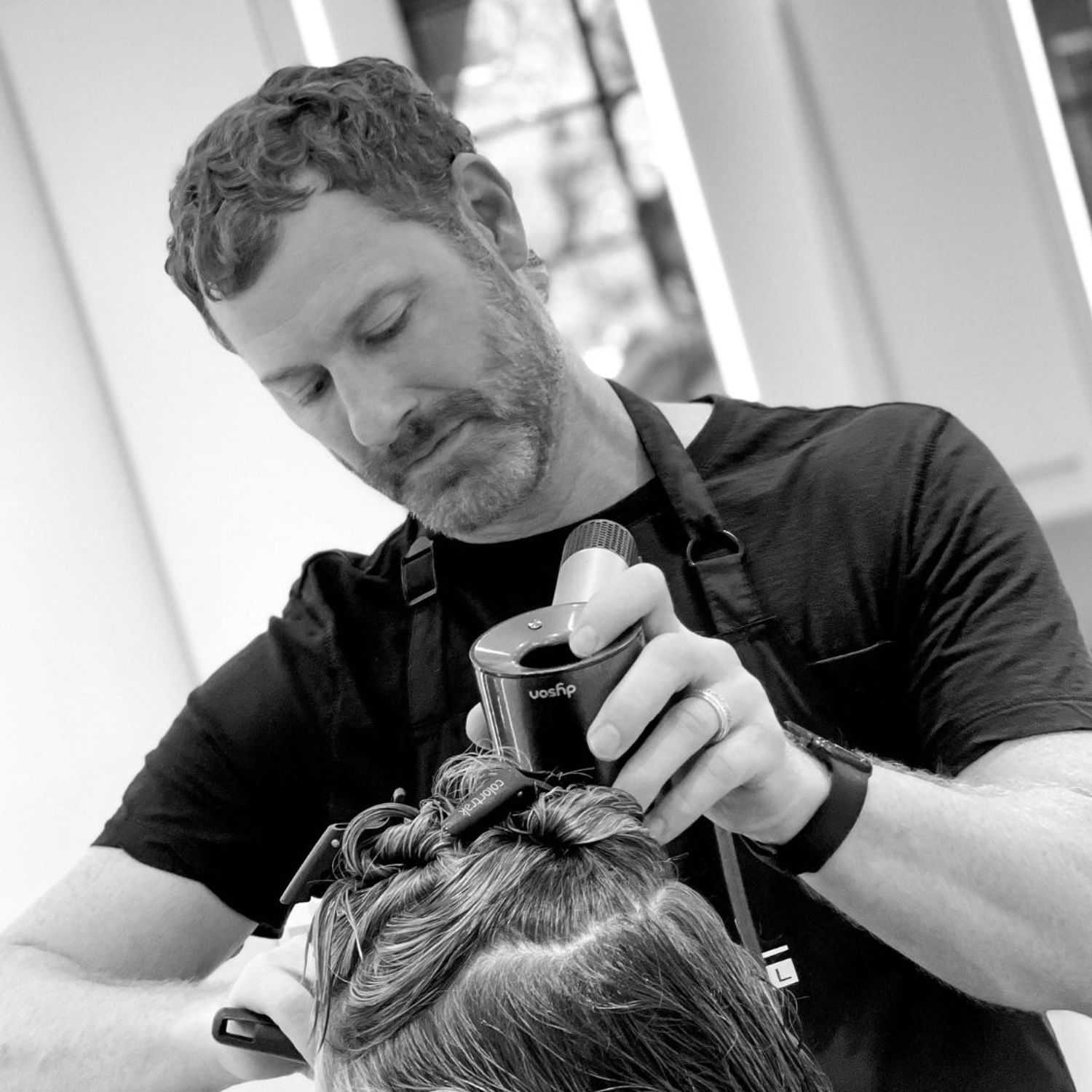 Portrait of James, a professional stylist at Hue Salon Houston, showcasing their expertise and style.