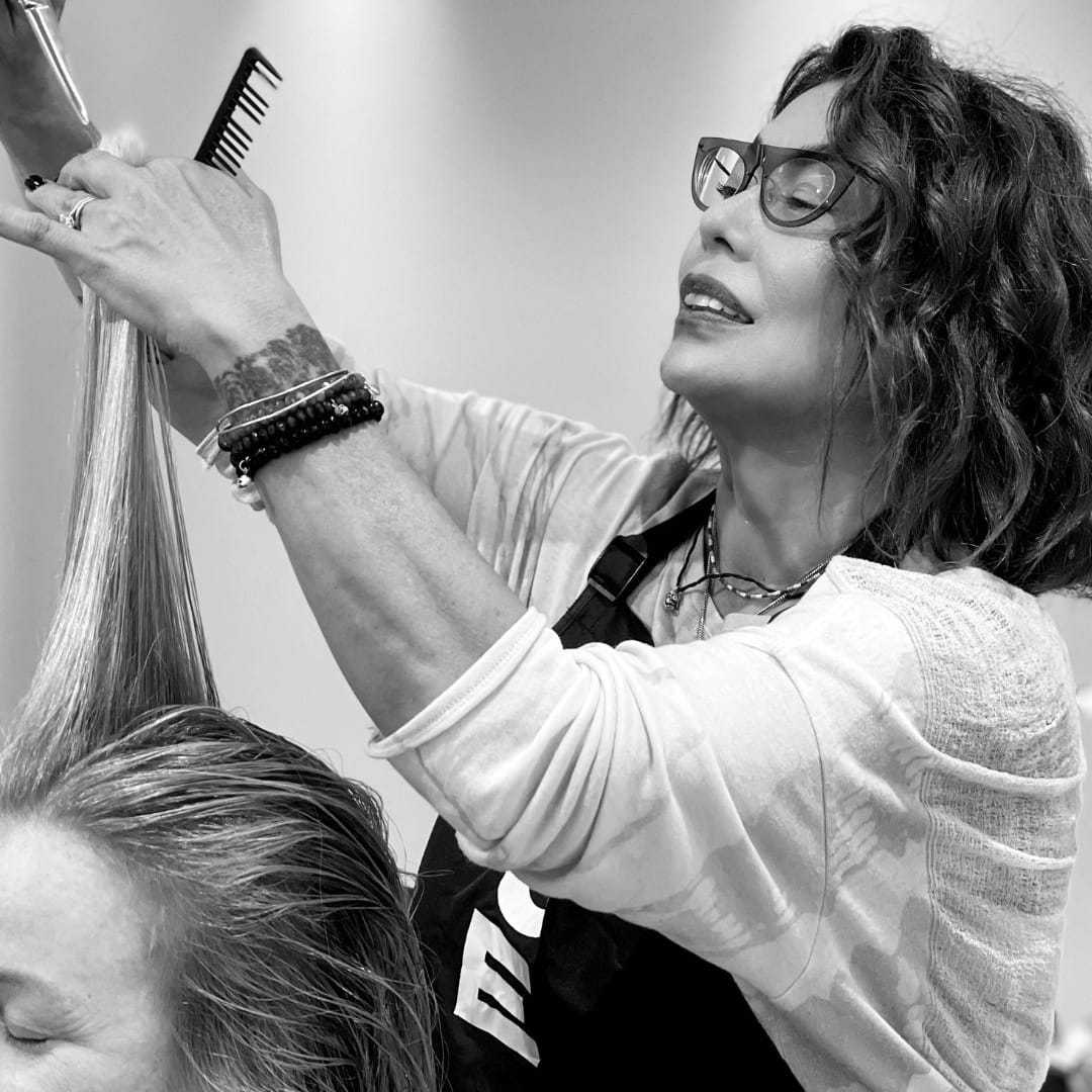 Portrait of Jo, a professional stylist at Hue Salon Houston, showcasing their expertise and style.