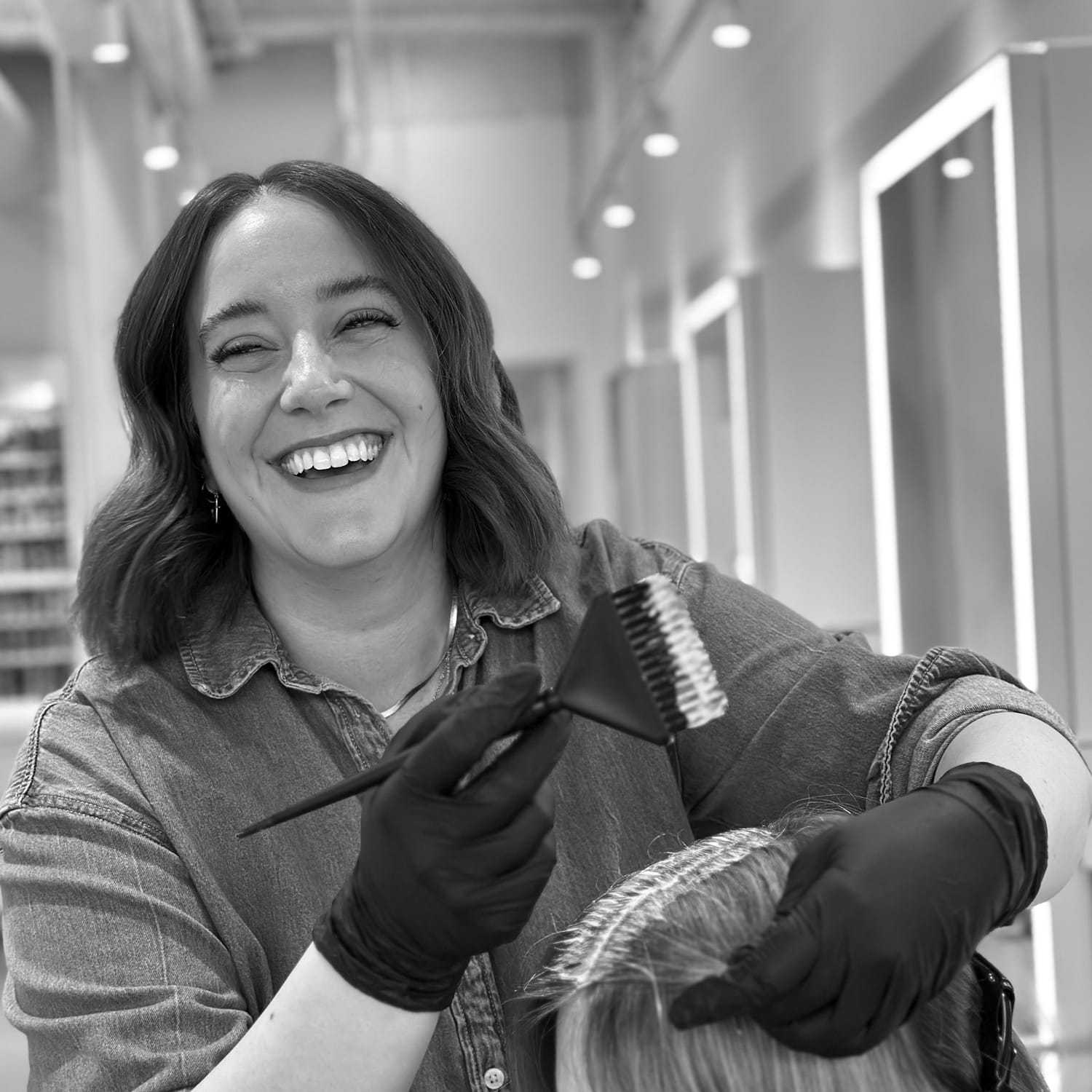 Portrait of Cassidy, a professional stylist at Hue Salon Houston, showcasing their expertise and style.