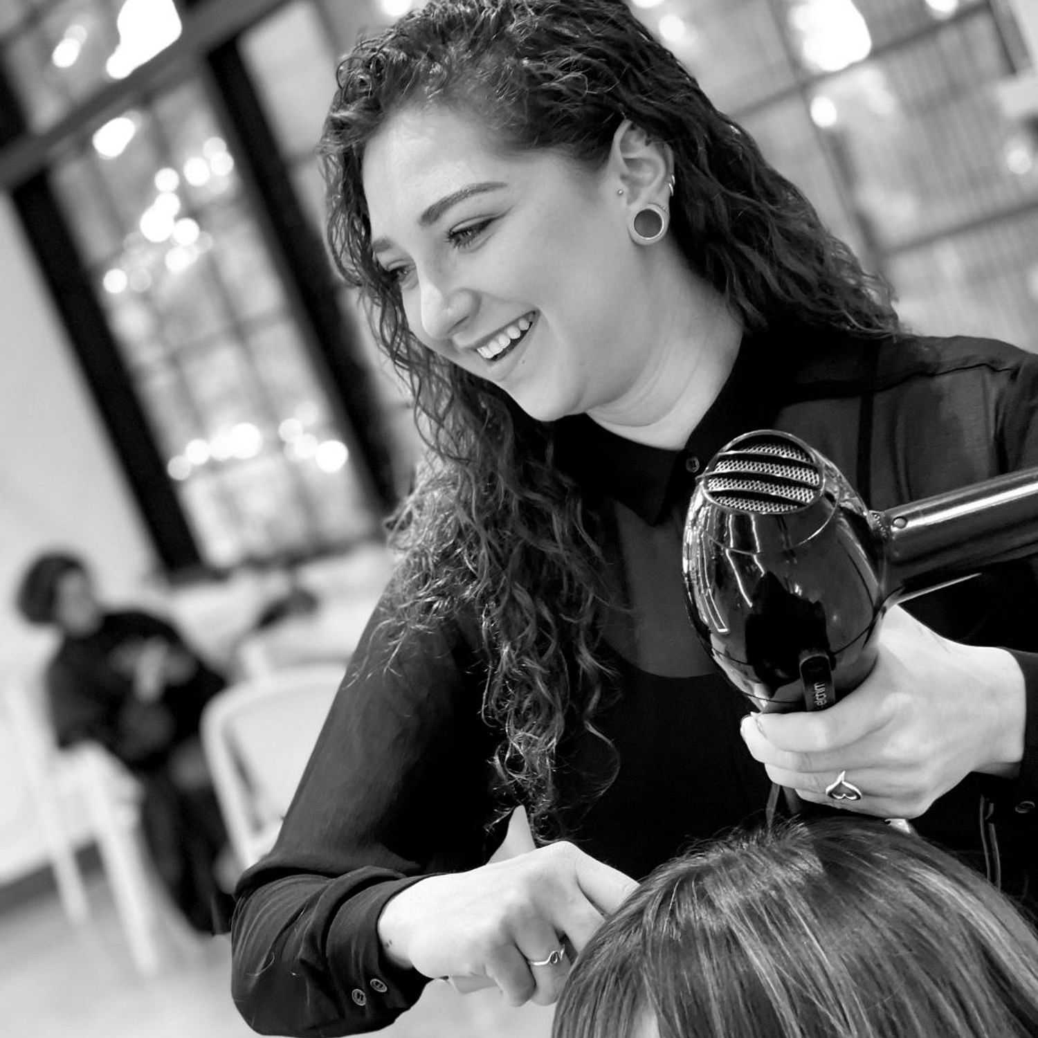 Portrait of Allegra, a professional stylist at Hue Salon Houston, showcasing their expertise and style.