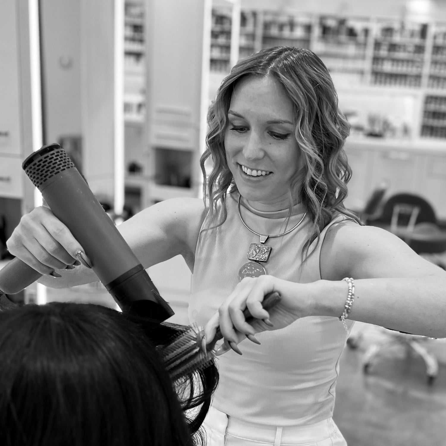 Portrait of Leslie, a professional stylist at Hue Salon Houston, showcasing their expertise and style.